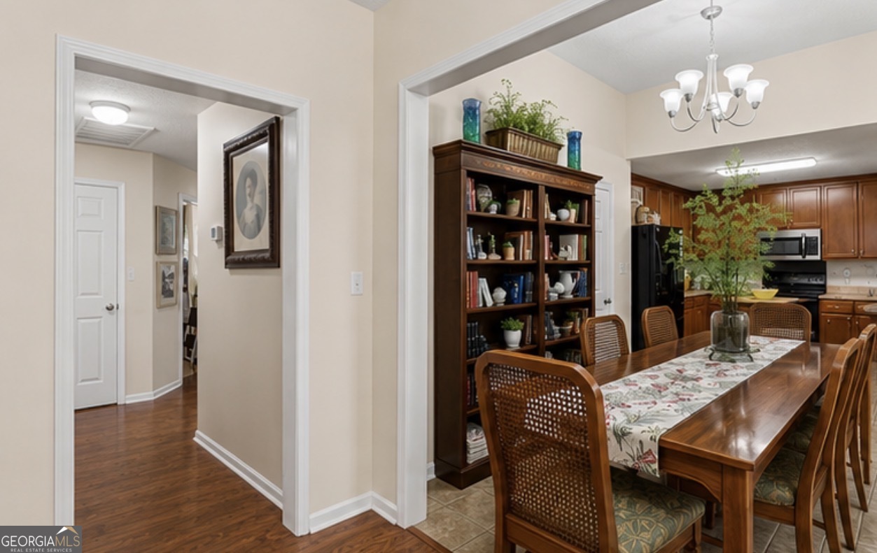 138 Brookfair Lane Leesburg, GA 31763 - Photo 8 of 30 a view of a dining room with furniture wooden floor and chandelier