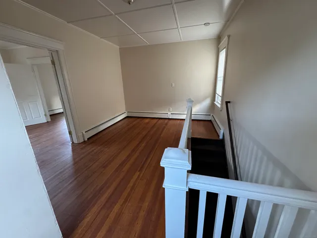 a view of entryway with wooden floor