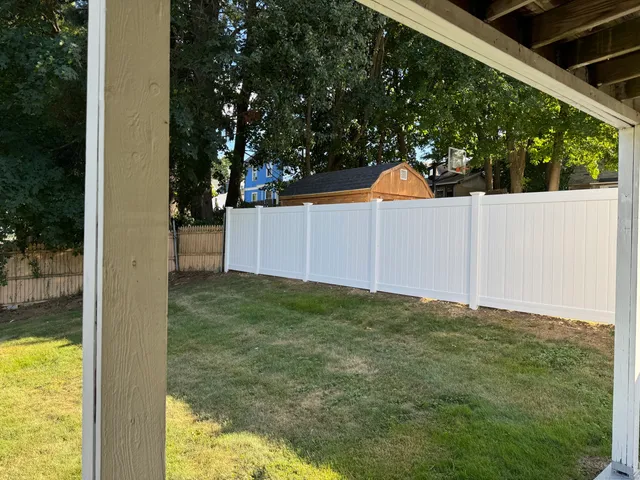 a view of a small yard from a balcony
