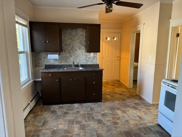 a kitchen with a stove and a sink