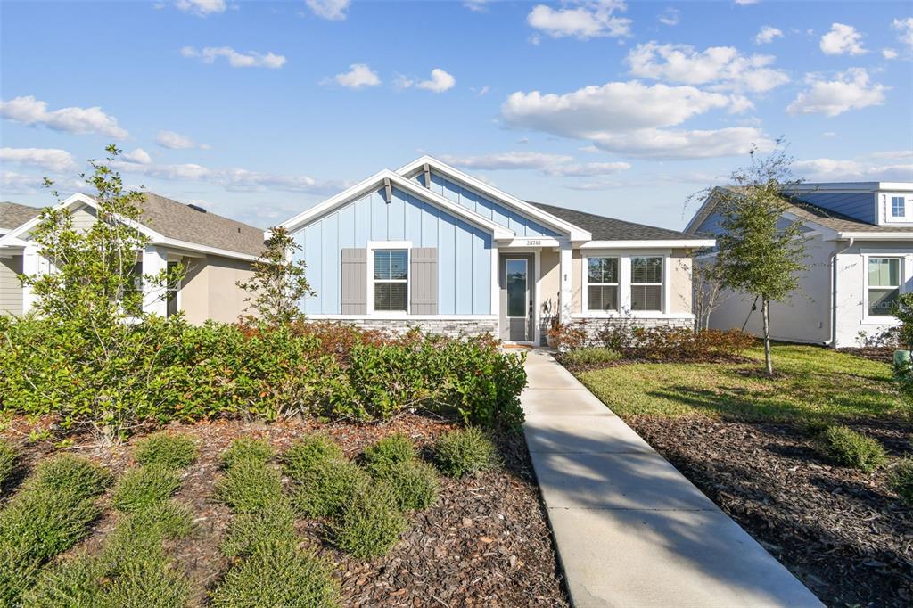 a front view of a house with garden