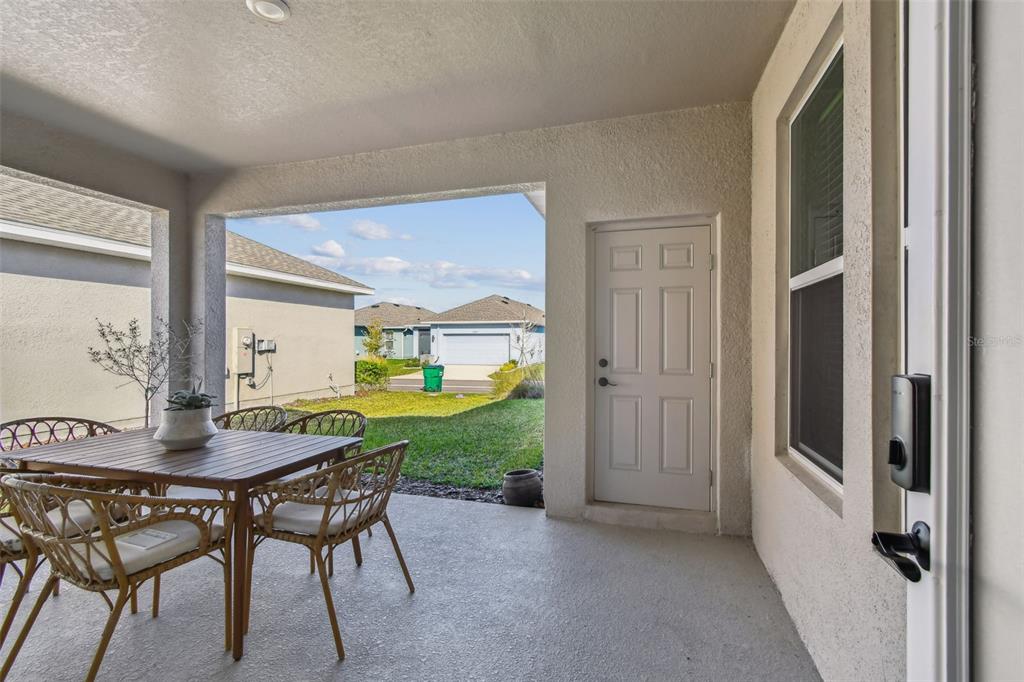 28748 Rambutan Drive Wesley Chapel, FL 33543 - Photo 25 of 37 a dining room with furniture and window
