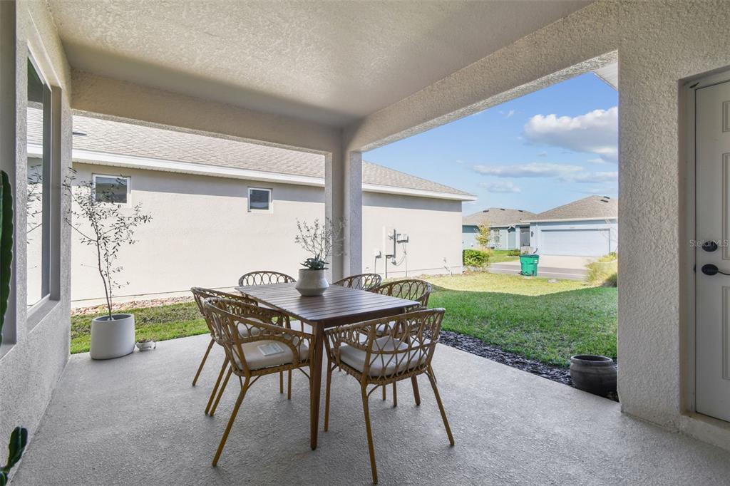 28748 Rambutan Drive Wesley Chapel, FL 33543 - Photo 26 of 37 a view of a dining room with furniture and a window