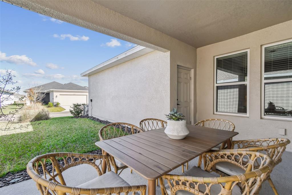 28748 Rambutan Drive Wesley Chapel, FL 33543 - Photo 28 of 37 a outdoor dining space with furniture and garden