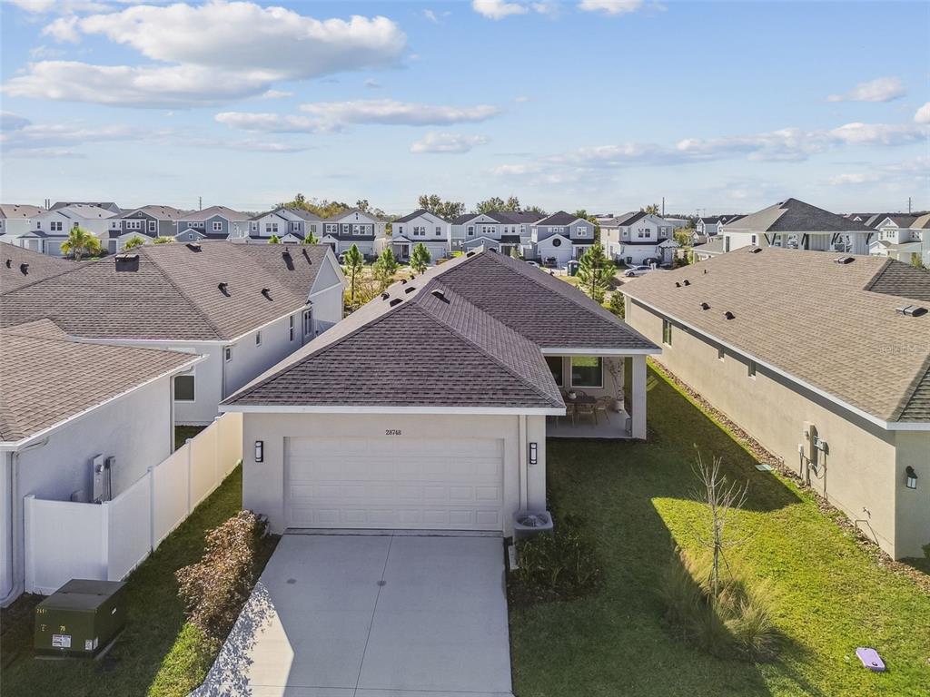 28748 Rambutan Drive Wesley Chapel, FL 33543 - Photo 30 of 37 a view of a house with a terrace
