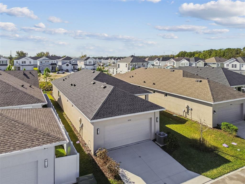 28748 Rambutan Drive Wesley Chapel, FL 33543 - Photo 31 of 37 a view of a terrace with lawn chairs