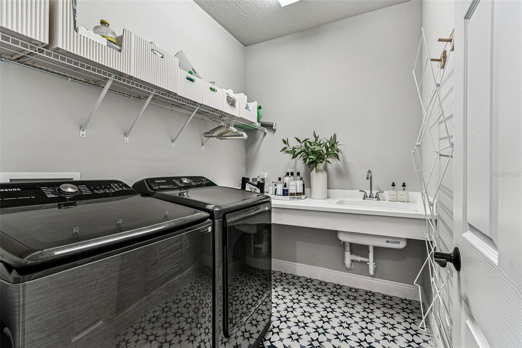 28748 Rambutan Drive Wesley Chapel, FL 33543 - Photo 10 of 37 a bathroom with a sink and a mirror