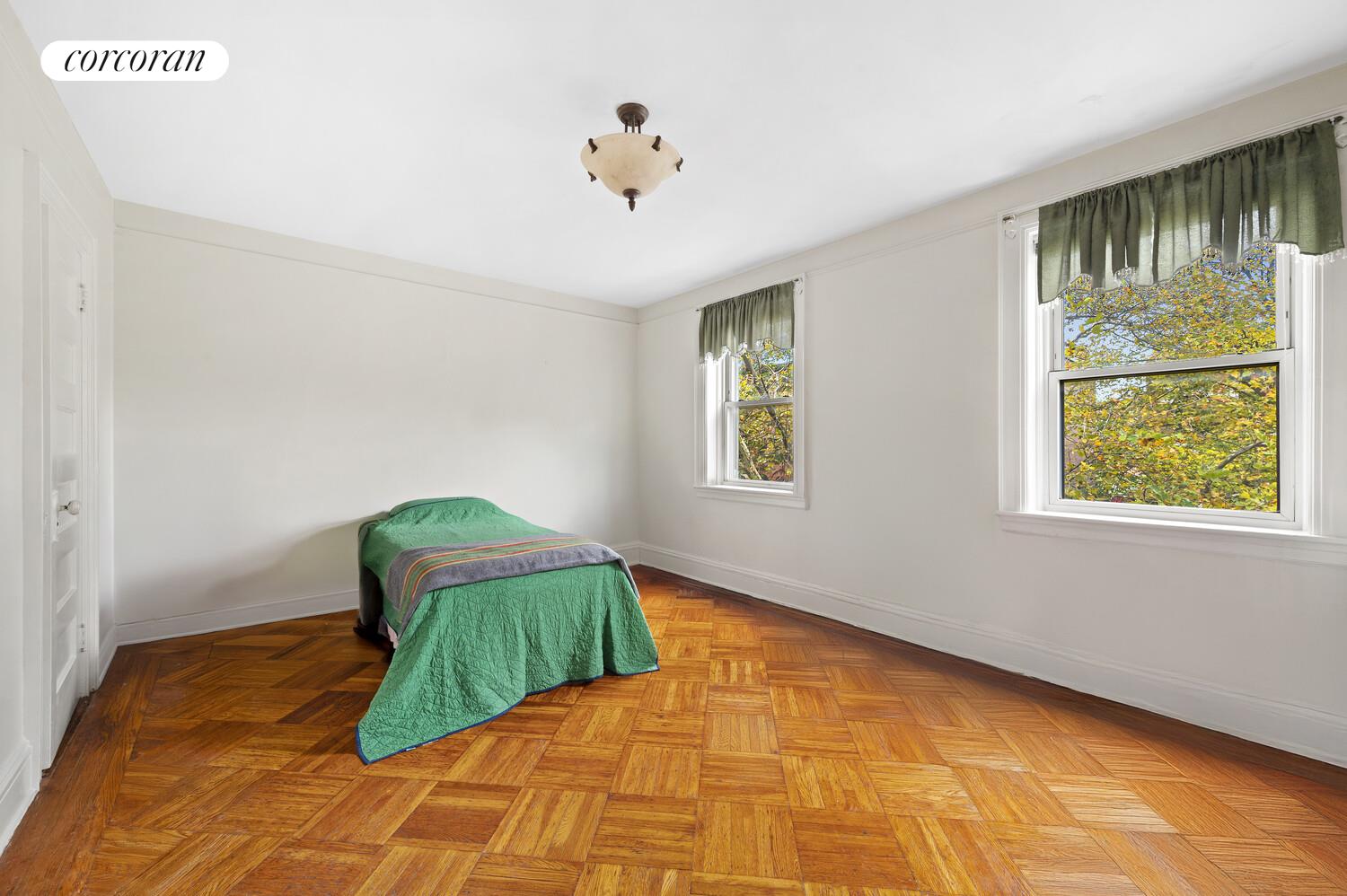 78 Midwood Street Brooklyn, NY 11225 - Photo 5 of 5 a bedroom with a bed and a window