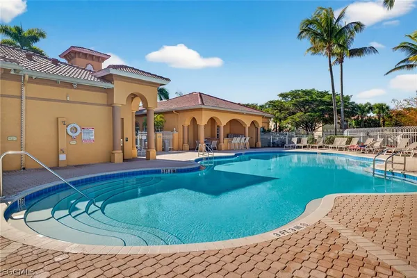 a view of a house with swimming pool yard and porch