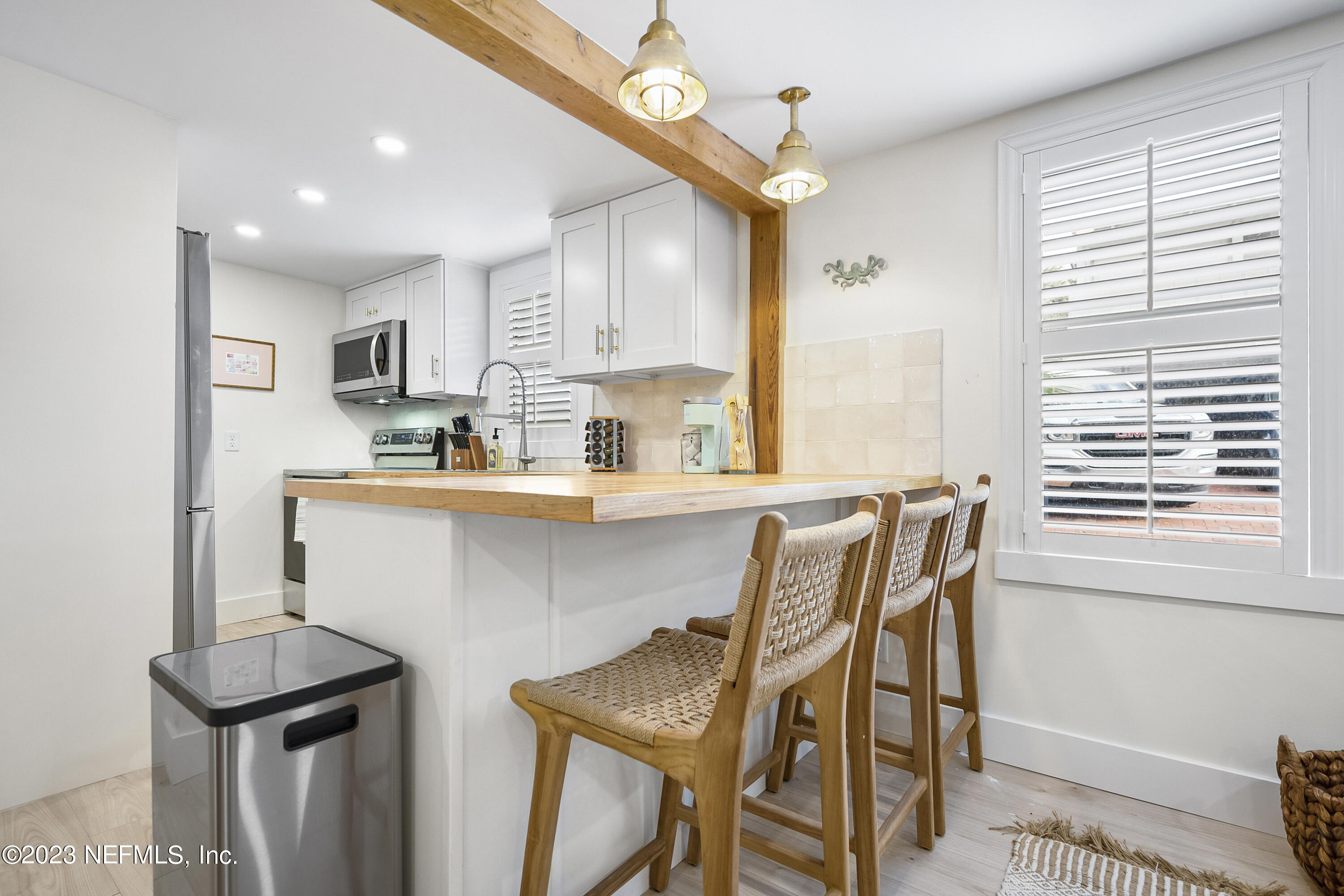23 26th Avenue South, Unit LOWR Jacksonville Beach, FL 32250 - Photo 11 of 23 a kitchen with a sink cabinets and window