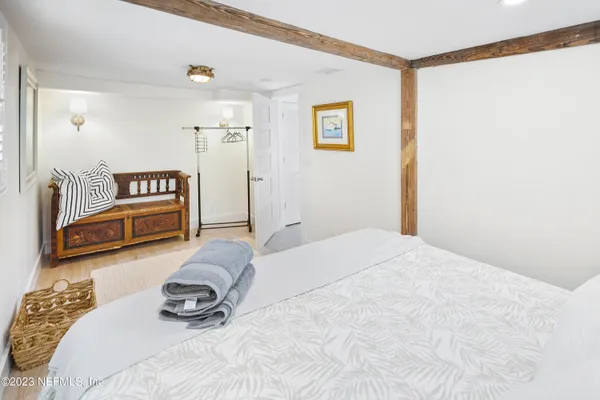 a bedroom with a bed and a view of bathroom