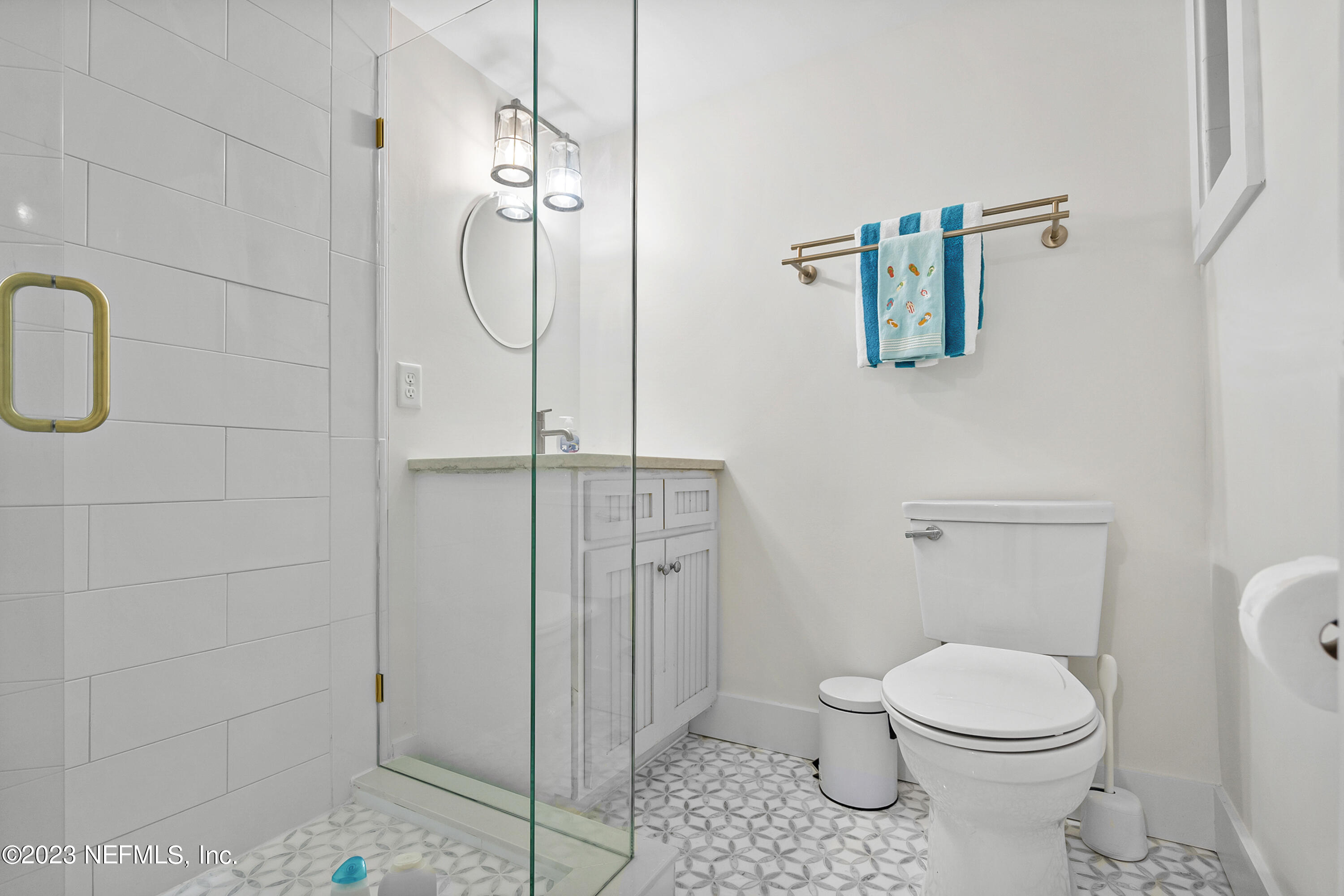 23 26th Avenue South, Unit LOWR Jacksonville Beach, FL 32250 - Photo 15 of 23 a bathroom with a toilet and shower