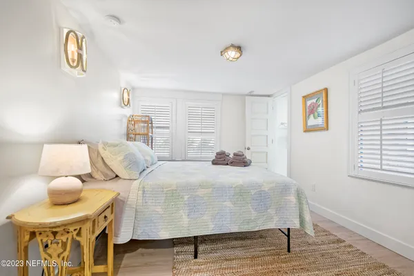 a bedroom with bed and a window