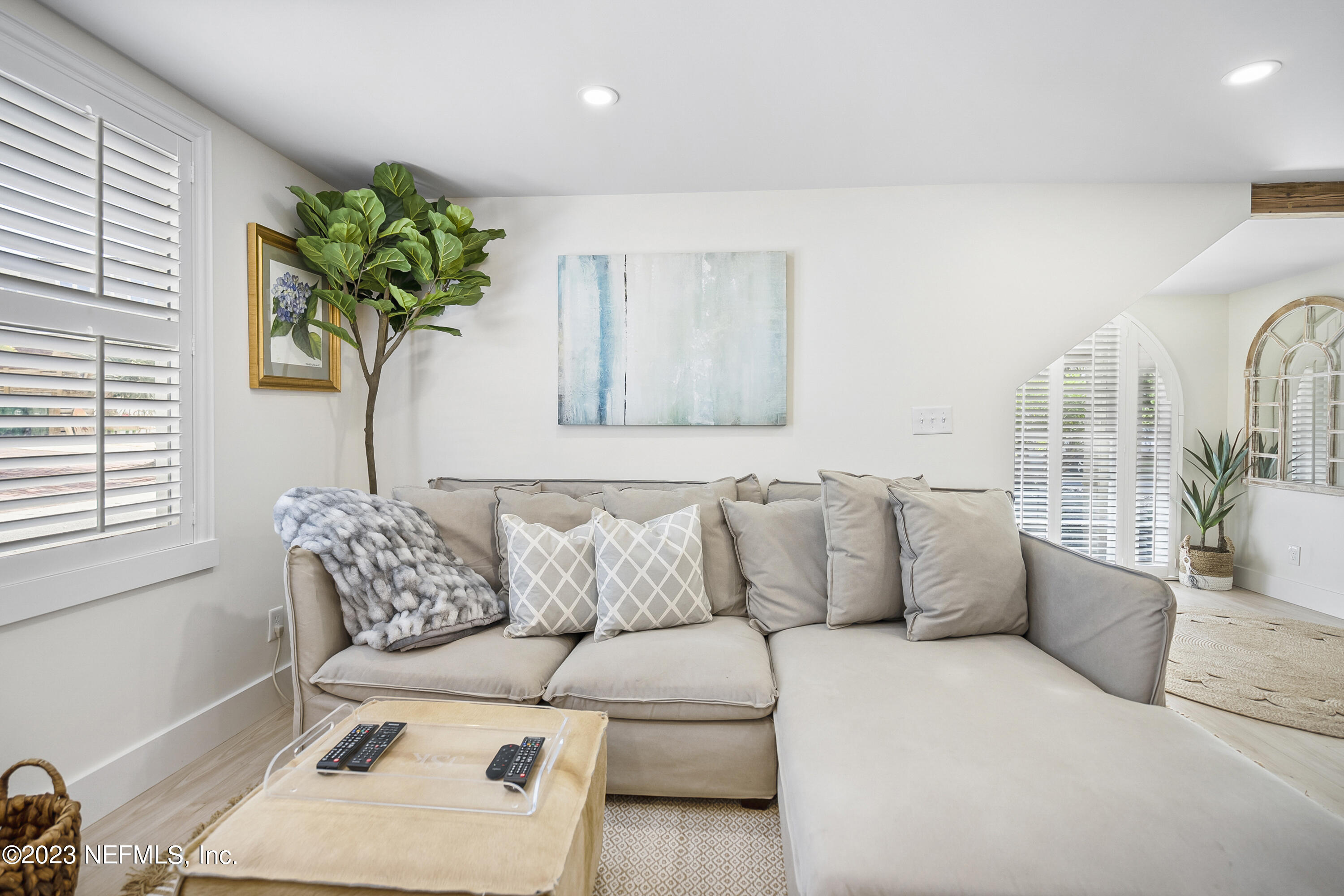 23 26th Avenue South, Unit LOWR Jacksonville Beach, FL 32250 - Photo 9 of 23 a living room with furniture flowerpot and a potted plant