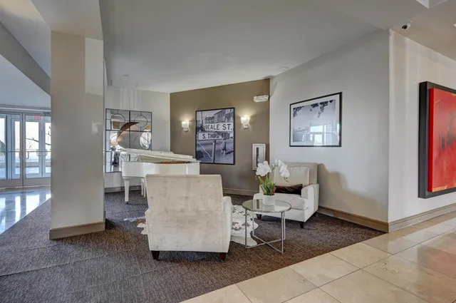 a living room with furniture and a table