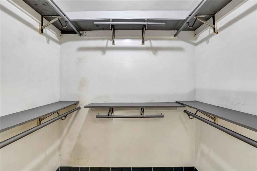 1266 Hickory Drive Southwest Lilburn, GA 30047 - Photo 33 of 49 a view of a room with racks on the wall