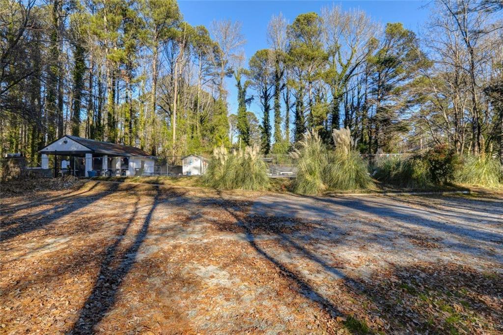 1266 Hickory Drive Southwest Lilburn, GA 30047 - Photo 40 of 49 a view of a yard with plants and trees