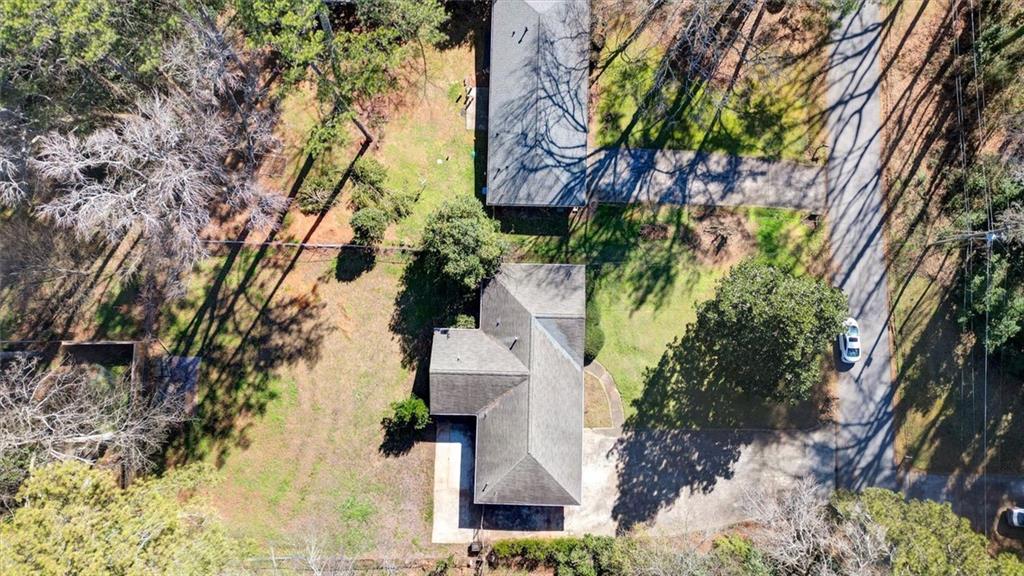 1266 Hickory Drive Southwest Lilburn, GA 30047 - Photo 8 of 49 an aerial view of a house with a yard