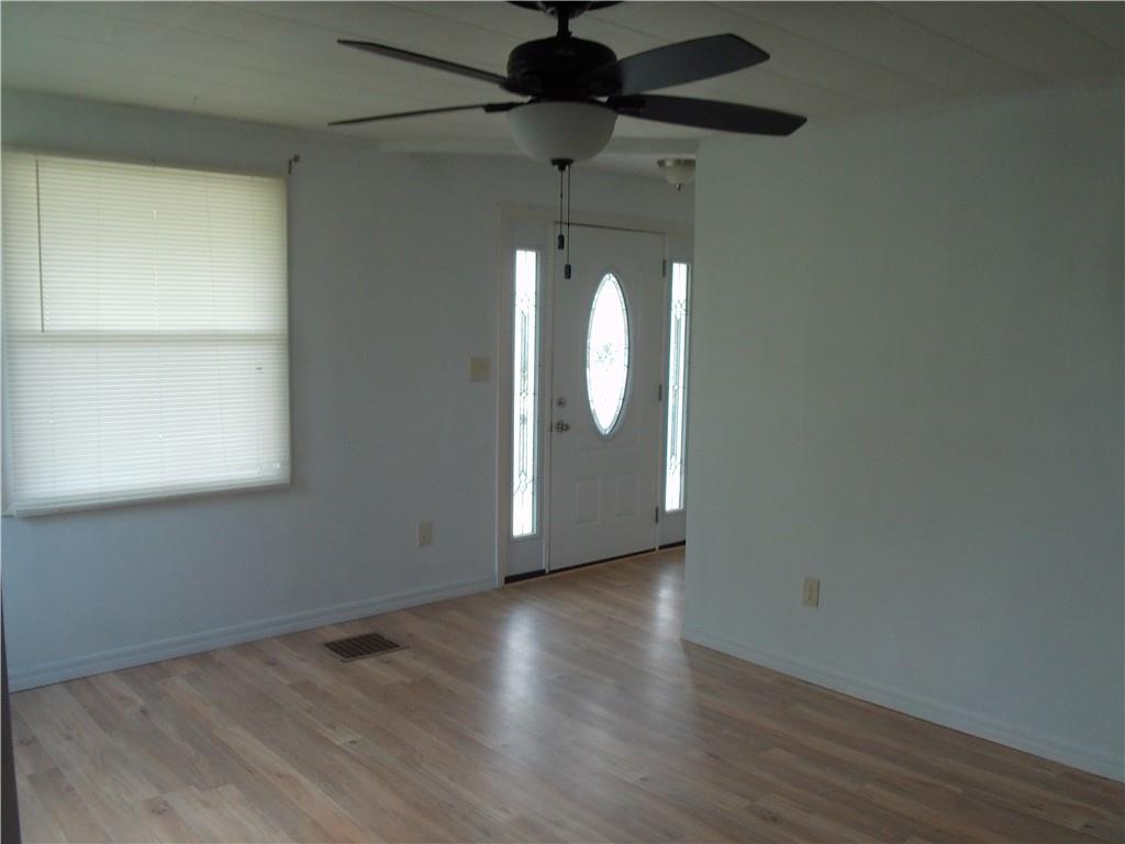 503 Greenfield Road Vanderbilt, PA 15486 - Photo 12 of 36 a view of a room with wooden floor and a ceiling fan