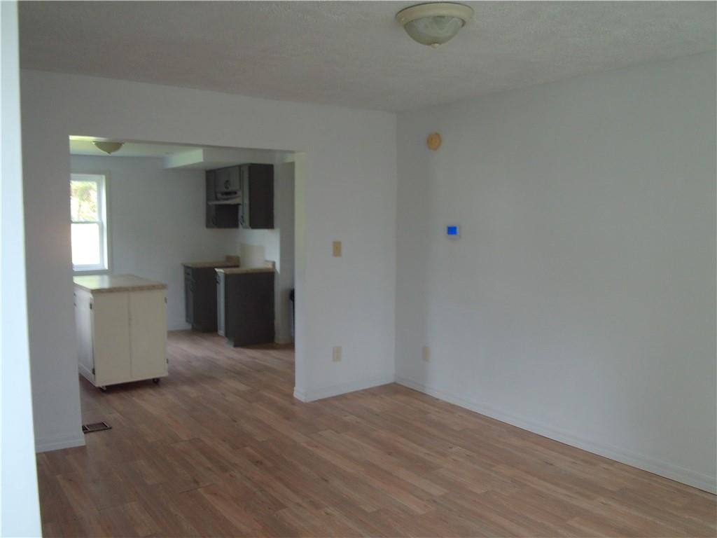 503 Greenfield Road Vanderbilt, PA 15486 - Photo 16 of 36 a view of a kitchen with wooden floor and electronic appliances