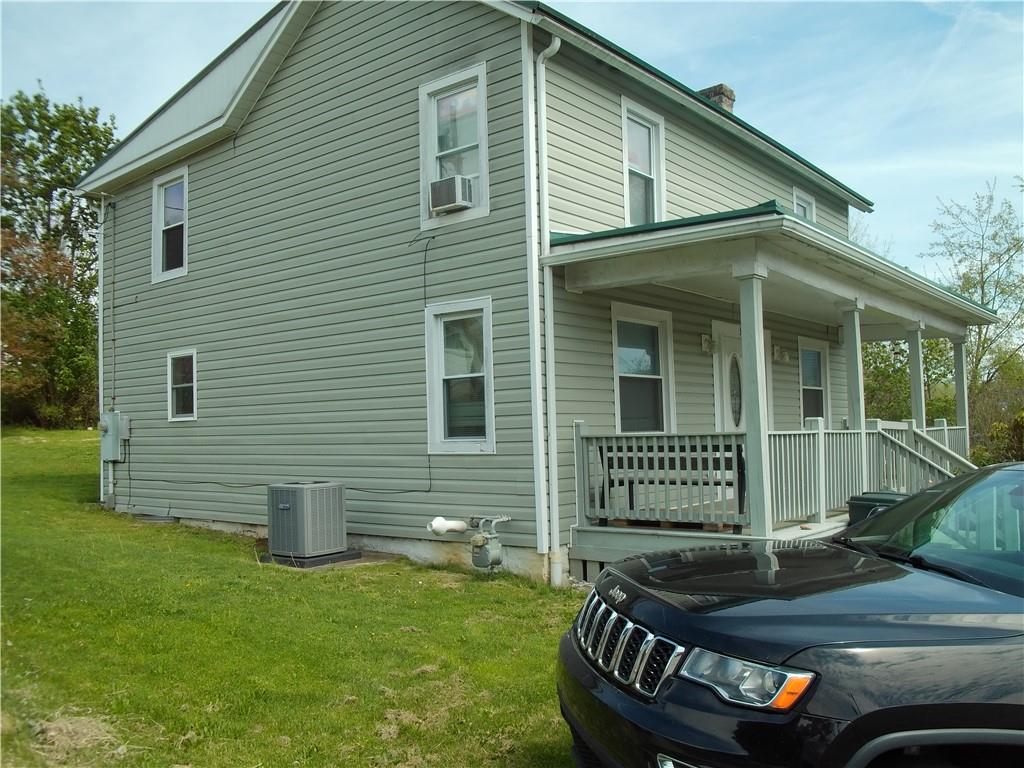 503 Greenfield Road Vanderbilt, PA 15486 - Photo 3 of 36 a front view of a house with a garden