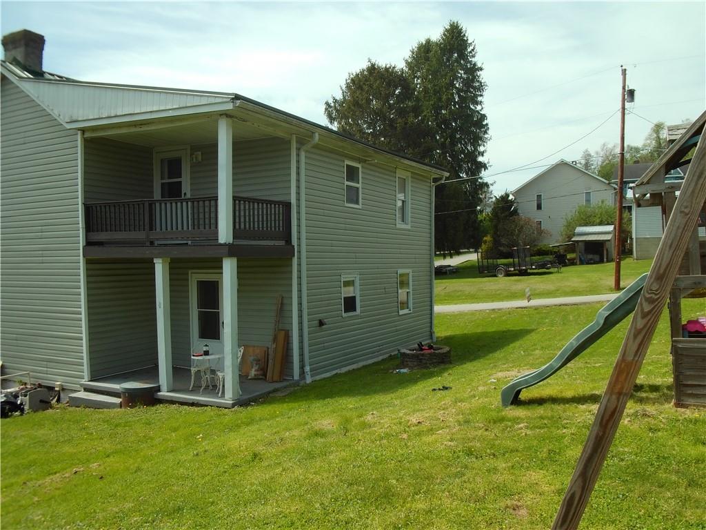 503 Greenfield Road Vanderbilt, PA 15486 - Photo 36 of 36 a view of a house with a backyard