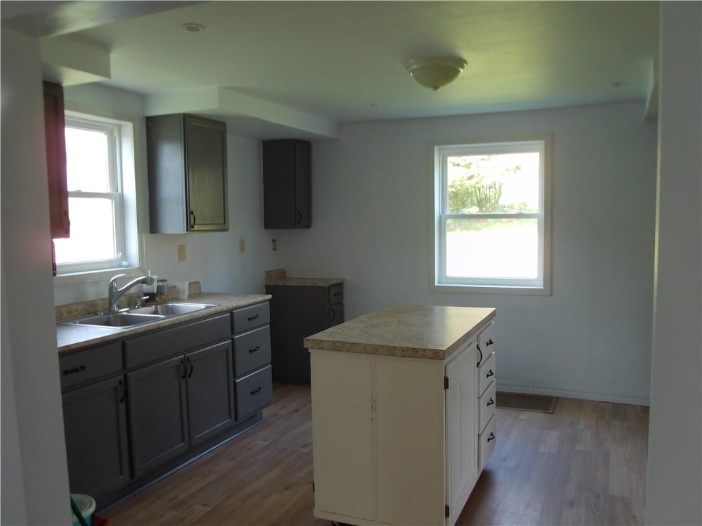 503 Greenfield Road Vanderbilt, PA 15486 - Photo 4 of 36 a kitchen with a stove a sink and a window