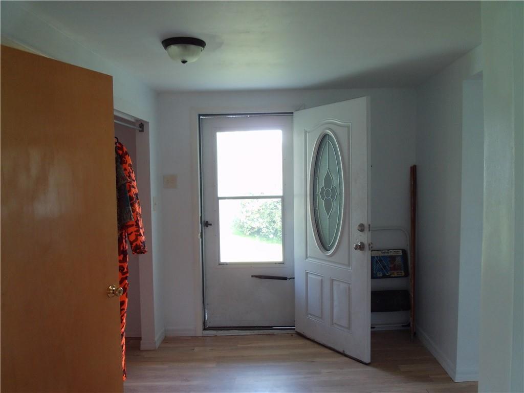 503 Greenfield Road Vanderbilt, PA 15486 - Photo 7 of 36 a view of a livingroom with wooden floor and window