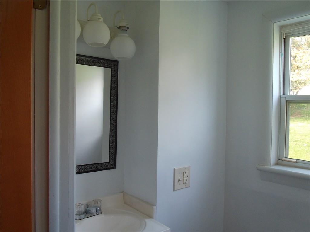 503 Greenfield Road Vanderbilt, PA 15486 - Photo 9 of 36 a bathroom with a toilet and a sink