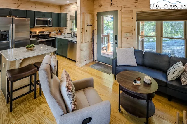 a living room with furniture and a window