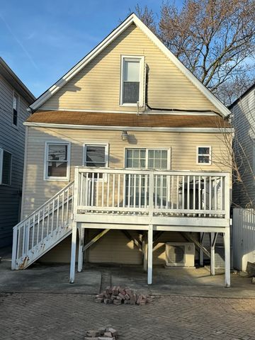 a balcony with table and chairs