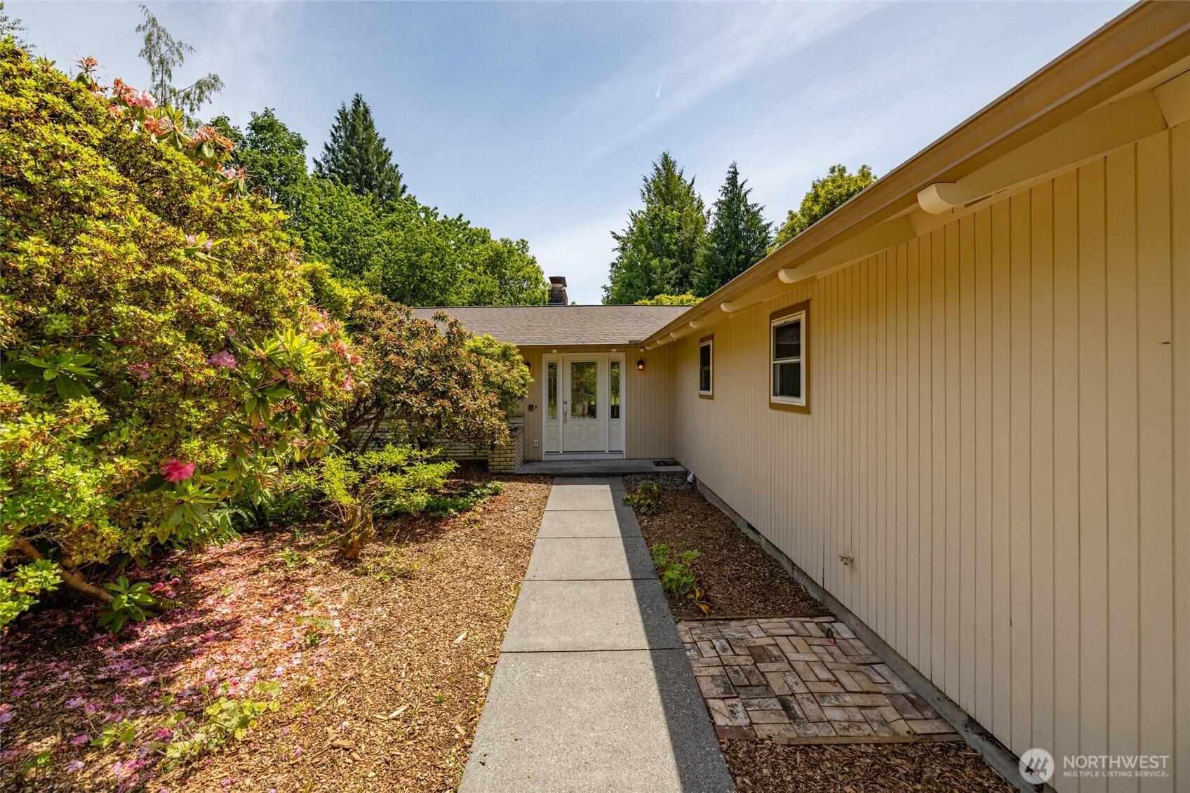 21316 Rolling Ridge Drive Sedro-Woolley, WA 98284 - Photo 2 of 37 a view of a backyard with potted plants