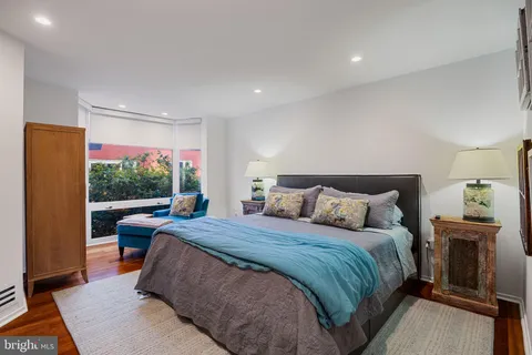 a room with a bed window and a couch