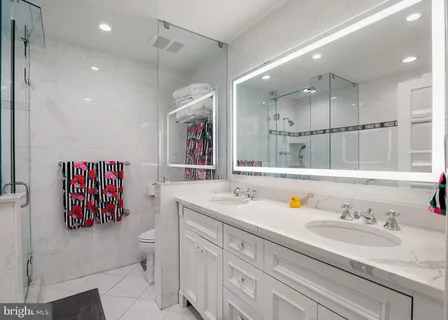 a bathroom with a bathtub and a shower
