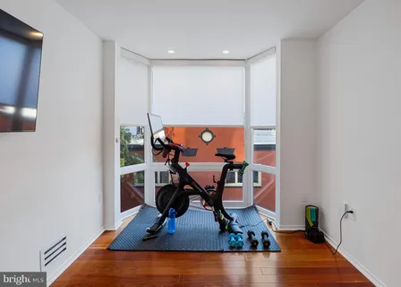 a room with furniture and a flat screen tv