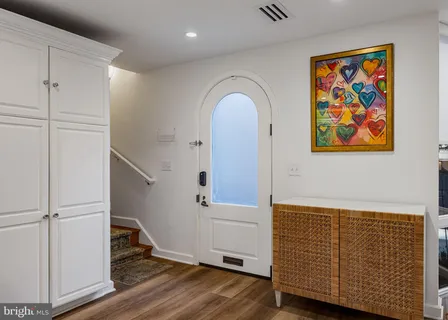 a view of entryway with wooden floor