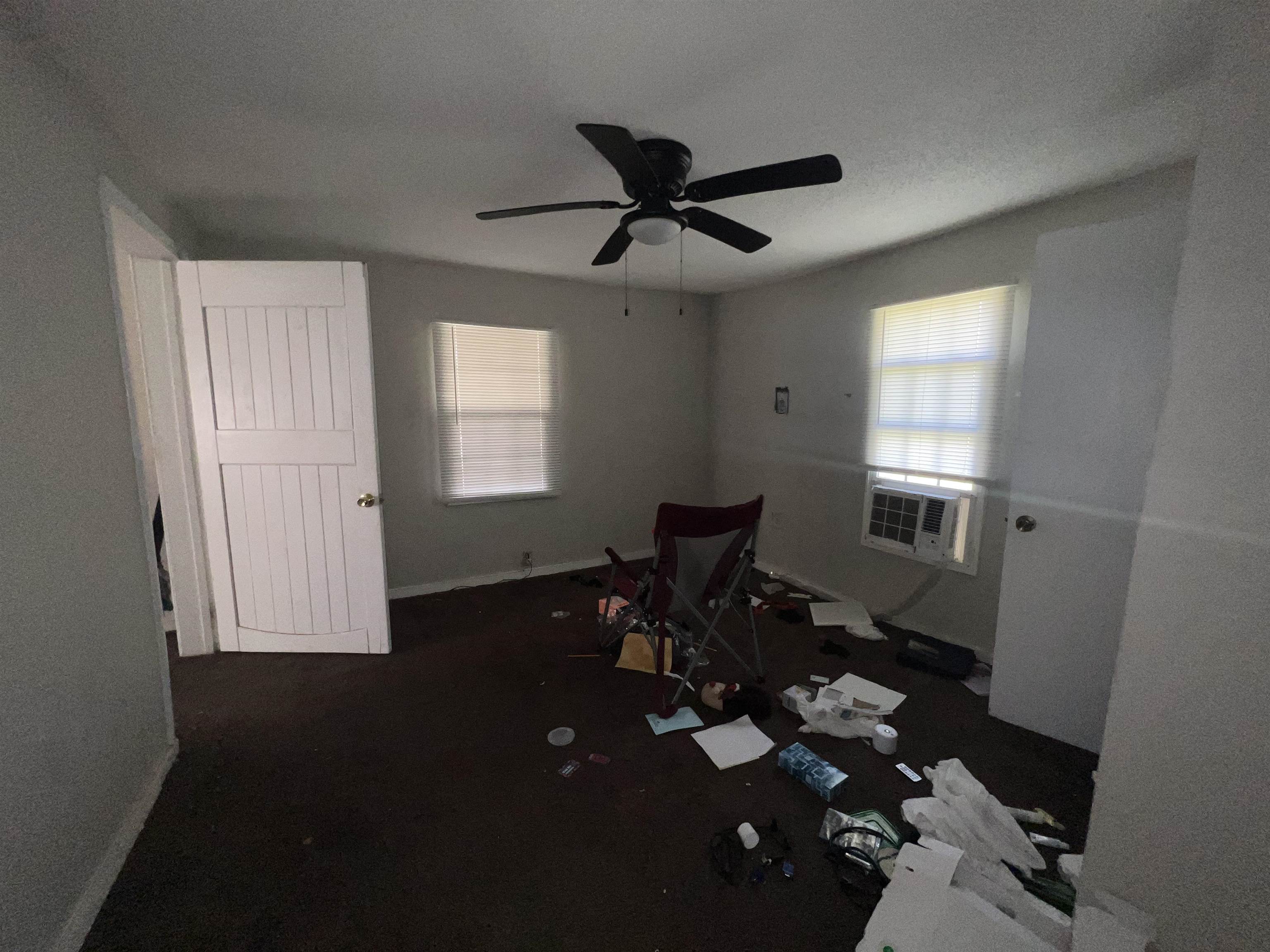 3044 Green Road Memphis, TN 38109 - Photo 8 of 15 Spare room featuring ceiling fan and dark colored carpet