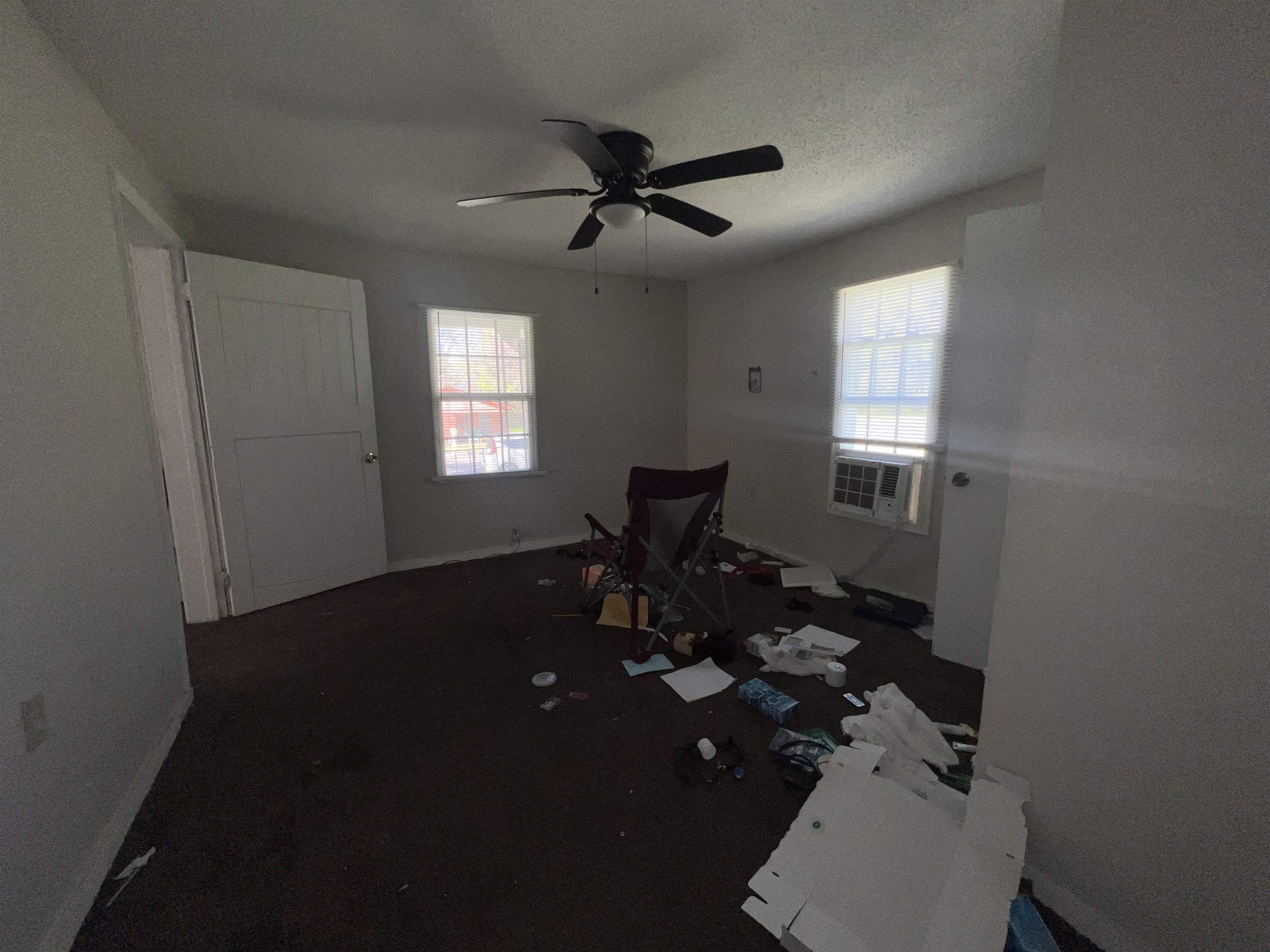 3044 Green Road Memphis, TN 38109 - Photo 10 of 15 Unfurnished room with plenty of natural light, ceiling fan, and a textured ceiling