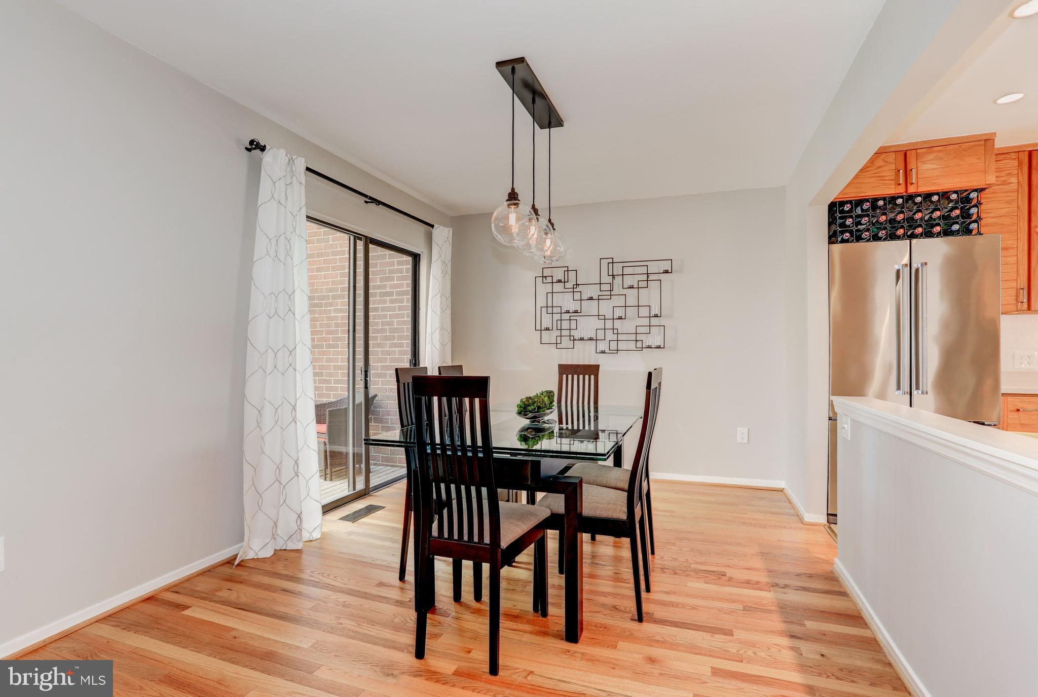 11762 Indian Ridge Road Reston, VA 20191 - Photo 11 of 30 a view of a dining room with furniture window and wooden floor