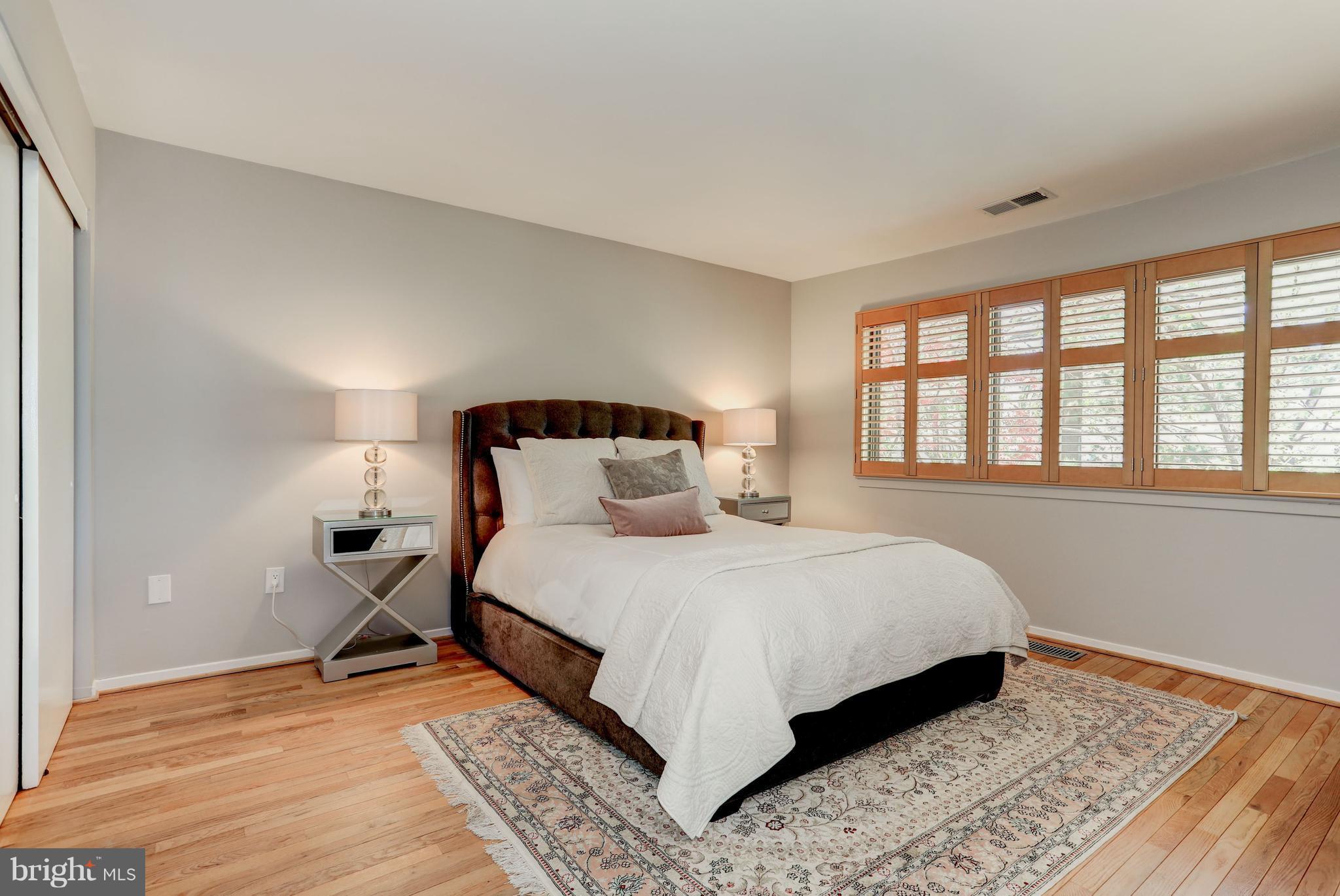 11762 Indian Ridge Road Reston, VA 20191 - Photo 13 of 30 a bedroom with a bed and a window