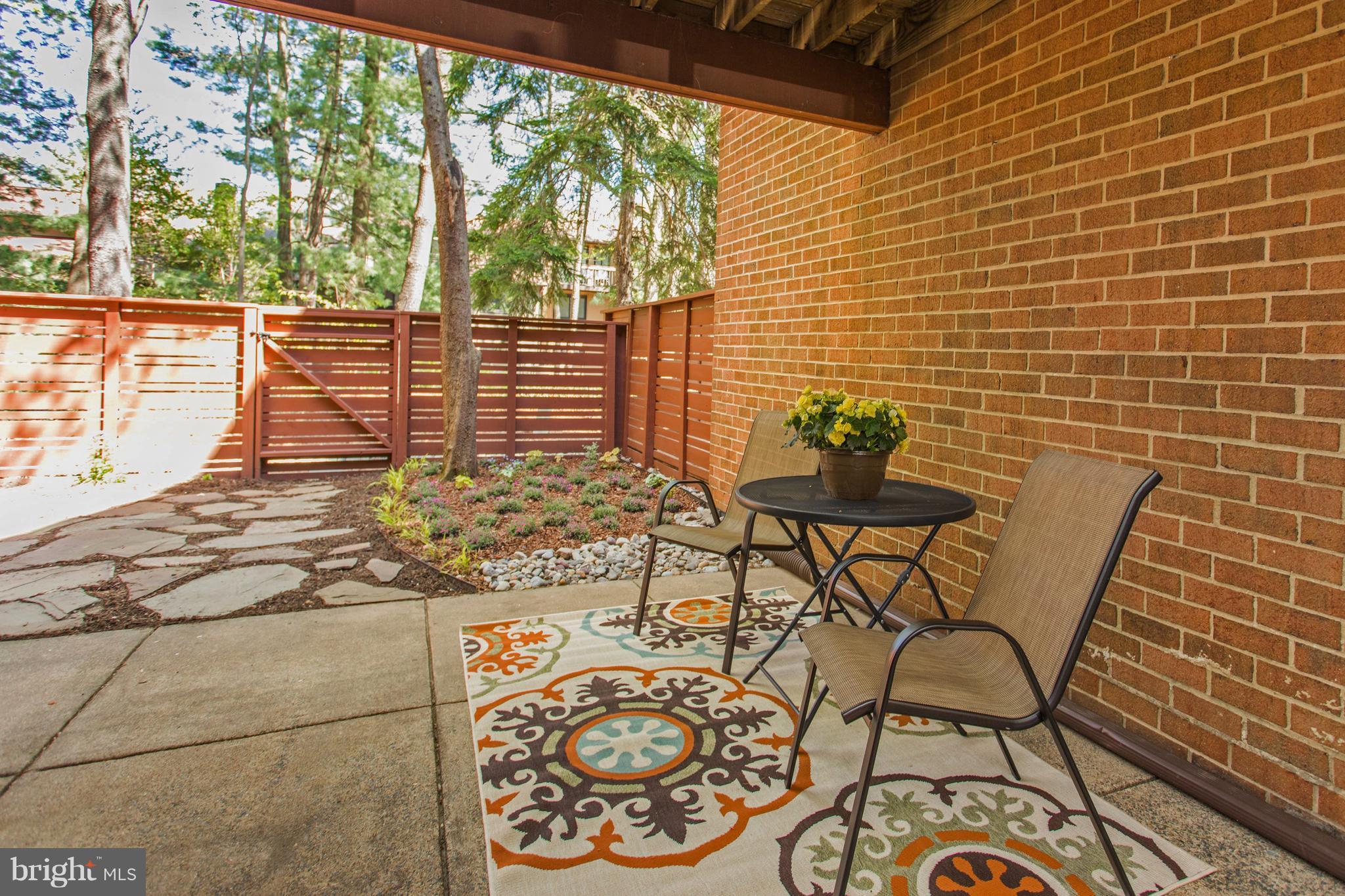 11762 Indian Ridge Road Reston, VA 20191 - Photo 24 of 30 a view of a chairs and table in the patio
