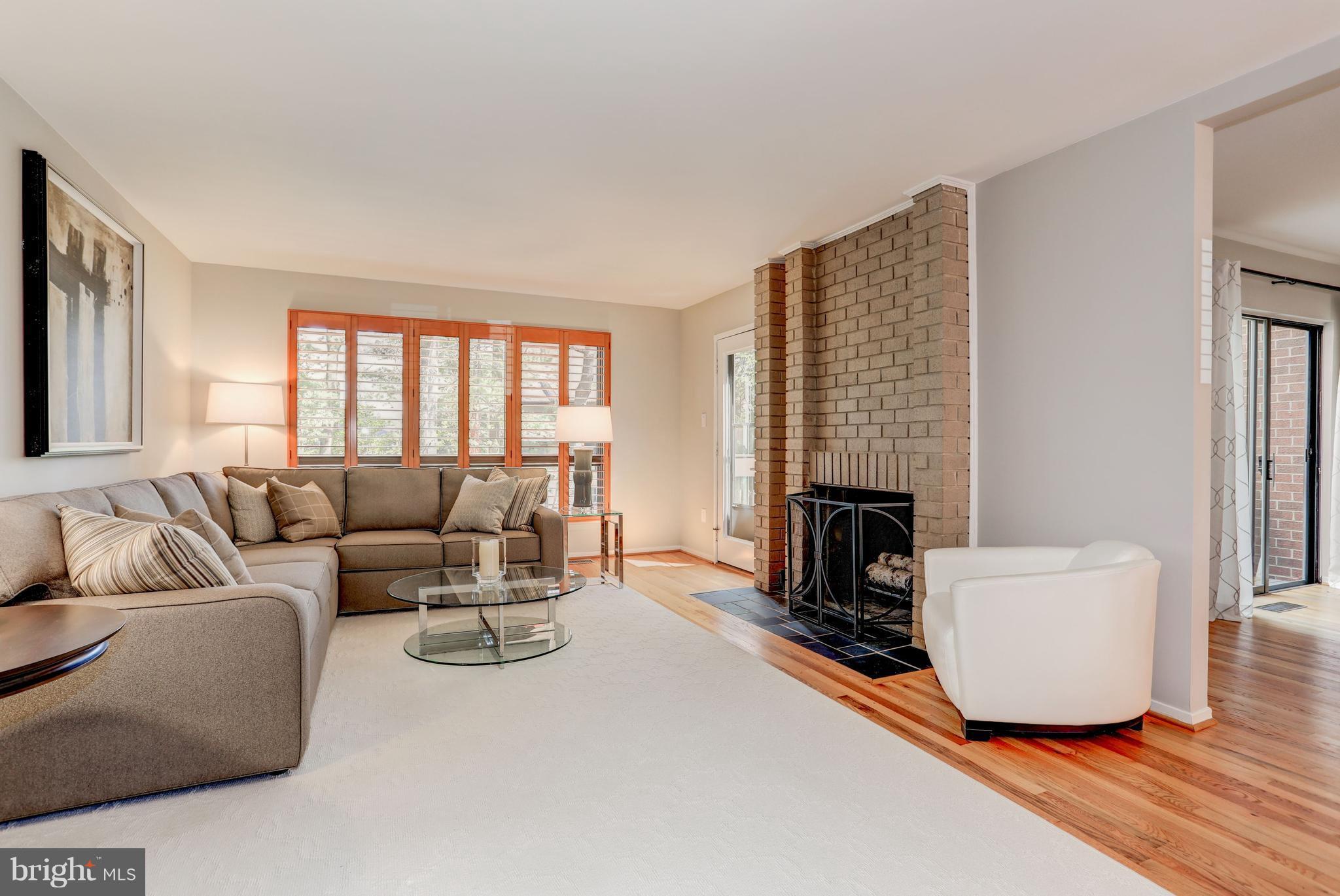 11762 Indian Ridge Road Reston, VA 20191 - Photo 6 of 30 a living room with fireplace furniture and a window