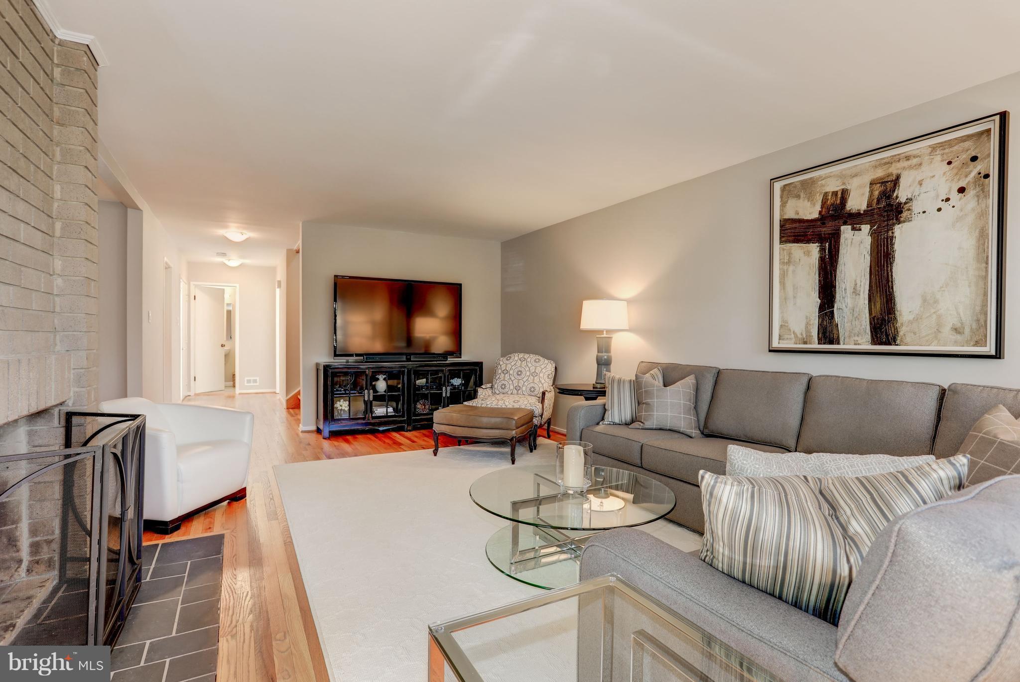 11762 Indian Ridge Road Reston, VA 20191 - Photo 7 of 30 a living room with furniture and a flat screen tv