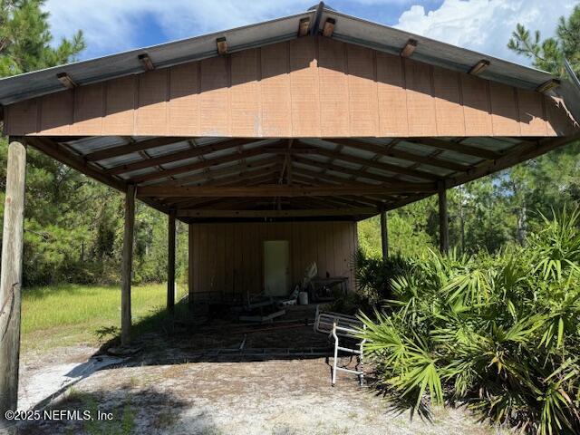 139 Lakeway Drive Georgetown, FL 32139 - Photo 6 of 59 a view of a backyard with couches under an umbrella