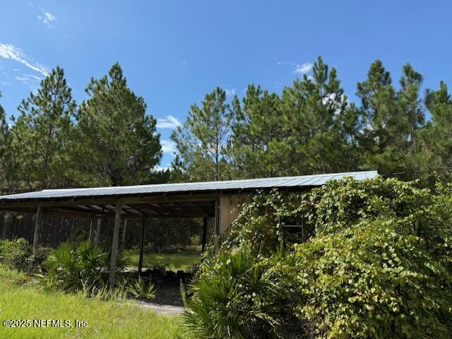 139 Lakeway Drive Georgetown, FL 32139 - Photo 7 of 59 a balcony with trees in front of it