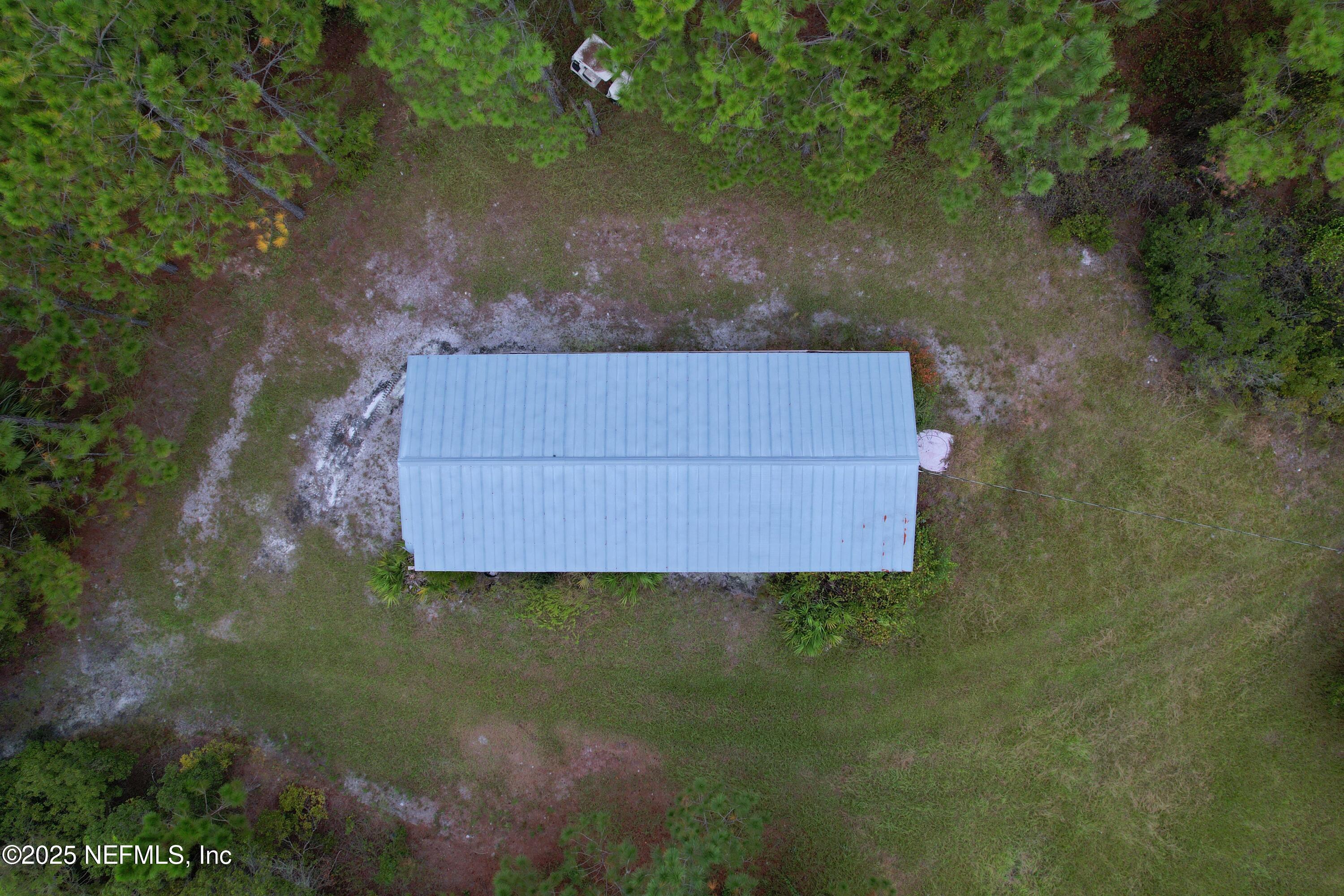 139 Lakeway Drive Georgetown, FL 32139 - Photo 9 of 59 a wooden bench sitting in a middle of a lake