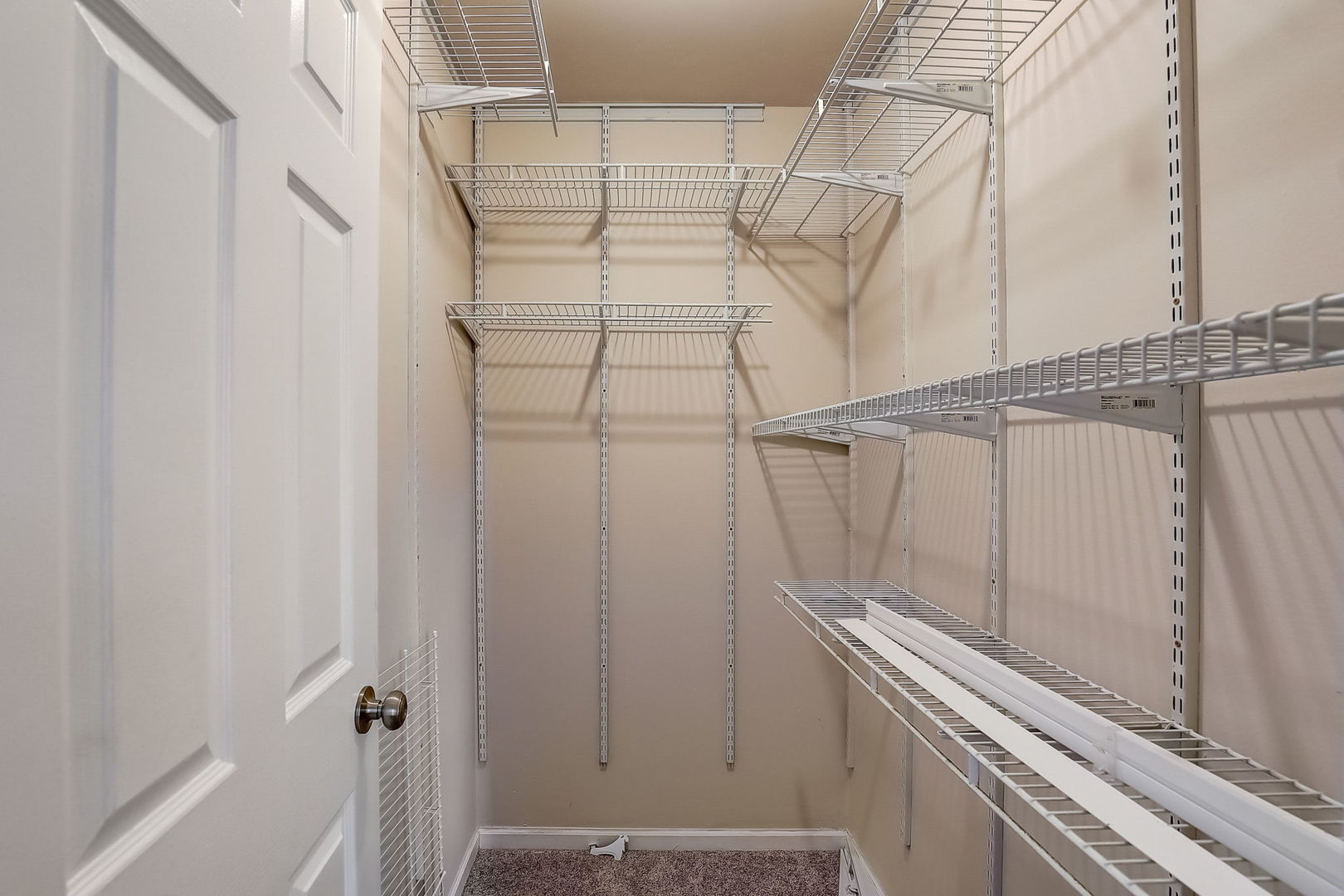 733 Thunderbird Trail Carol Stream, IL 60188 - Photo 17 of 31 a view of a room with racks on the wall