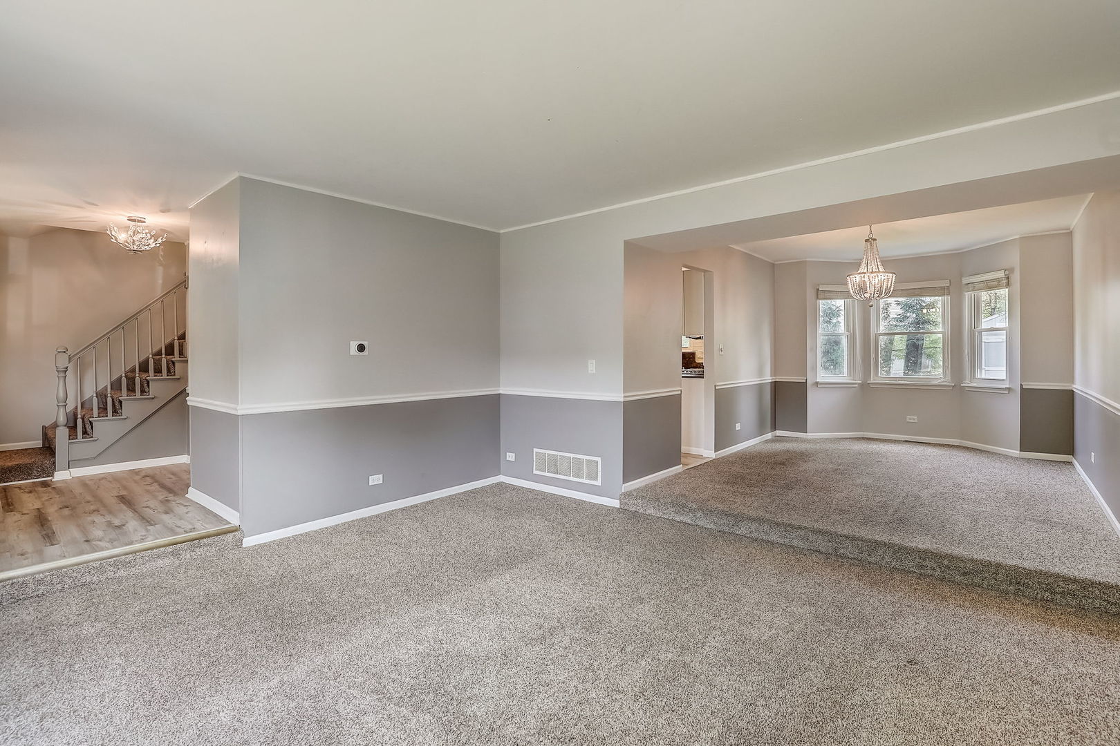 733 Thunderbird Trail Carol Stream, IL 60188 - Photo 2 of 31 a view of an empty room with kitchen and window