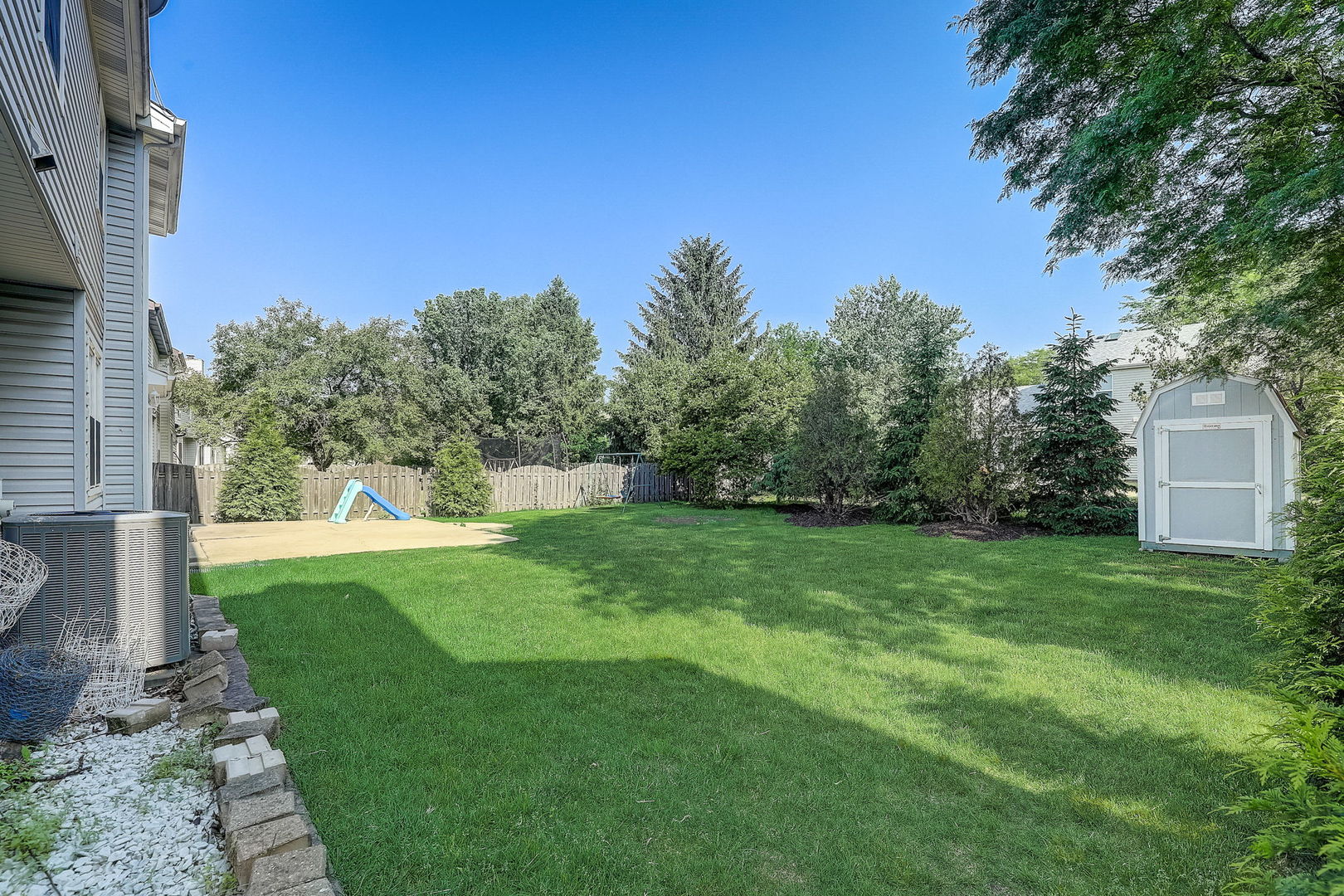 733 Thunderbird Trail Carol Stream, IL 60188 - Photo 25 of 31 a view of a backyard with a garden
