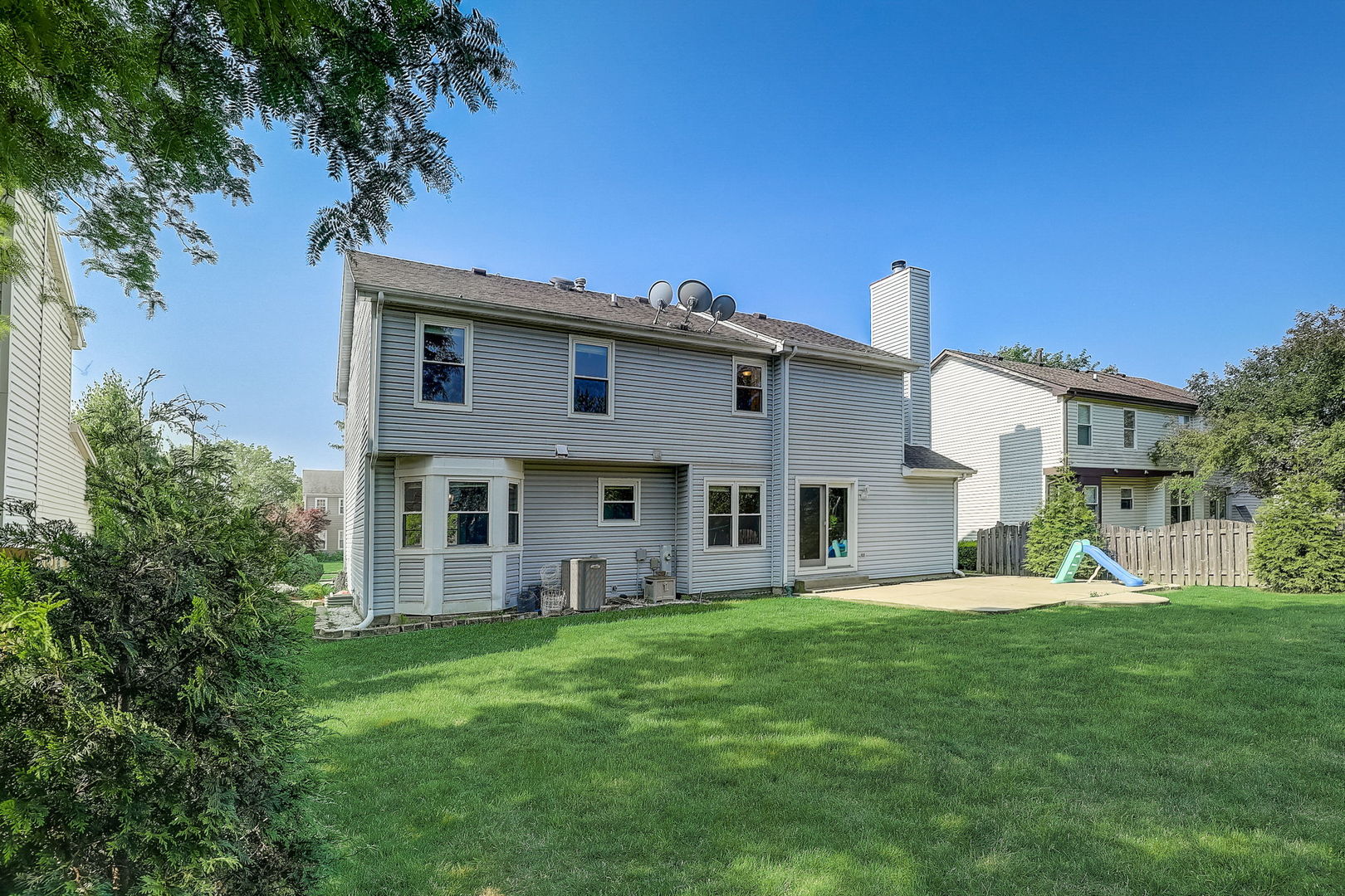 733 Thunderbird Trail Carol Stream, IL 60188 - Photo 26 of 31 a house view with a sitting space and garden